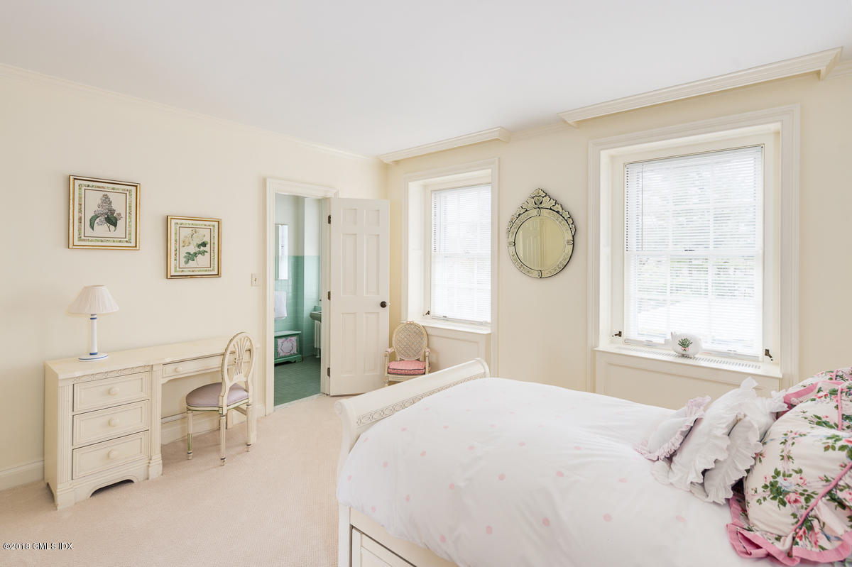 16 Rock Ridge Avenue Greenwich, CT 06831 - Photo 38 of 57 a bedroom with a bed and a window