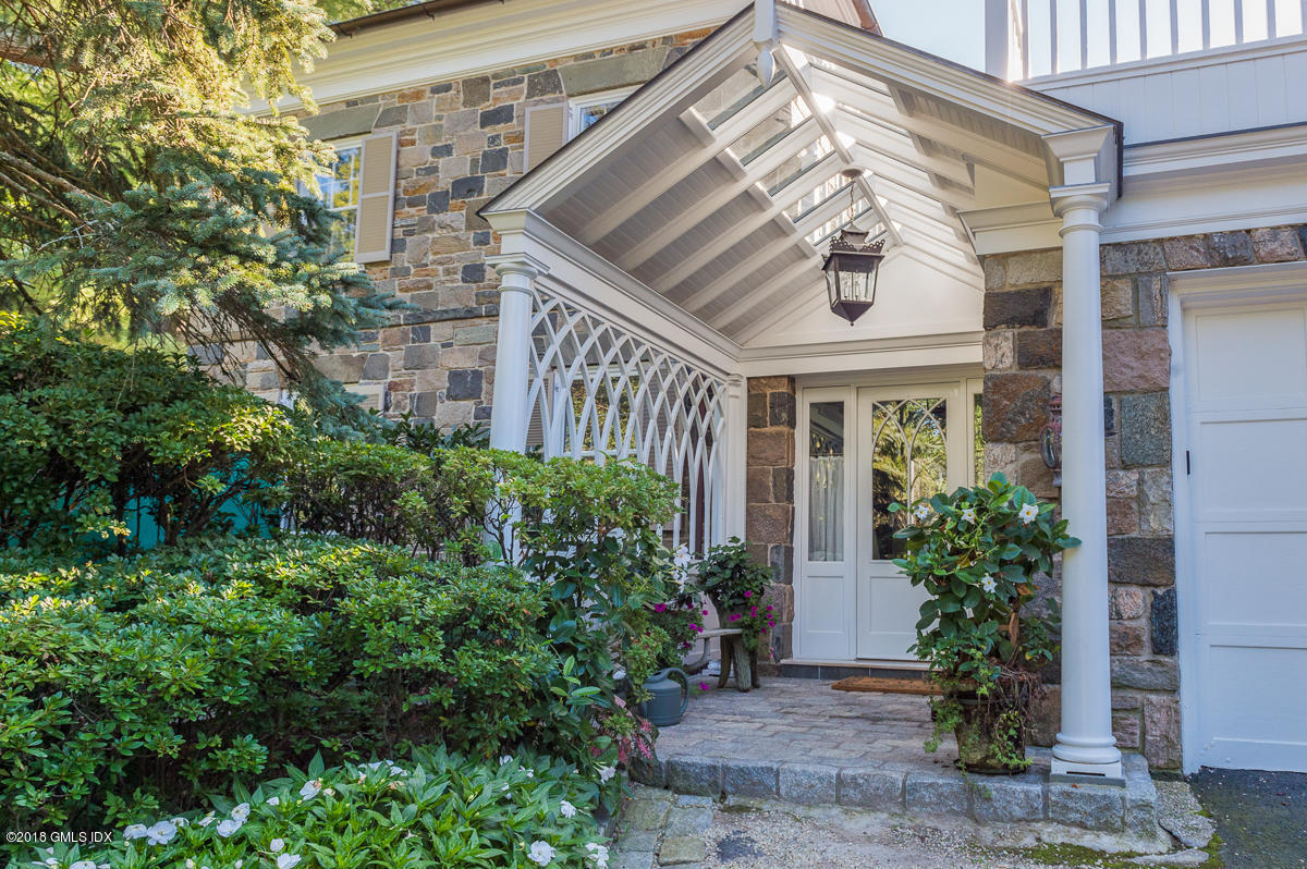16 Rock Ridge Avenue Greenwich, CT 06831 - Photo 39 of 57 a front view of a house with garden