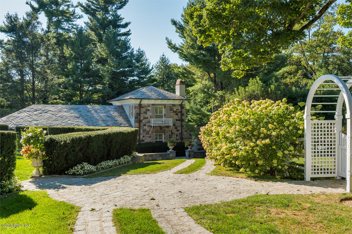 16 Rock Ridge Avenue Greenwich, CT 06831 - Photo 40 of 57 a view of a house with backyard and sitting area