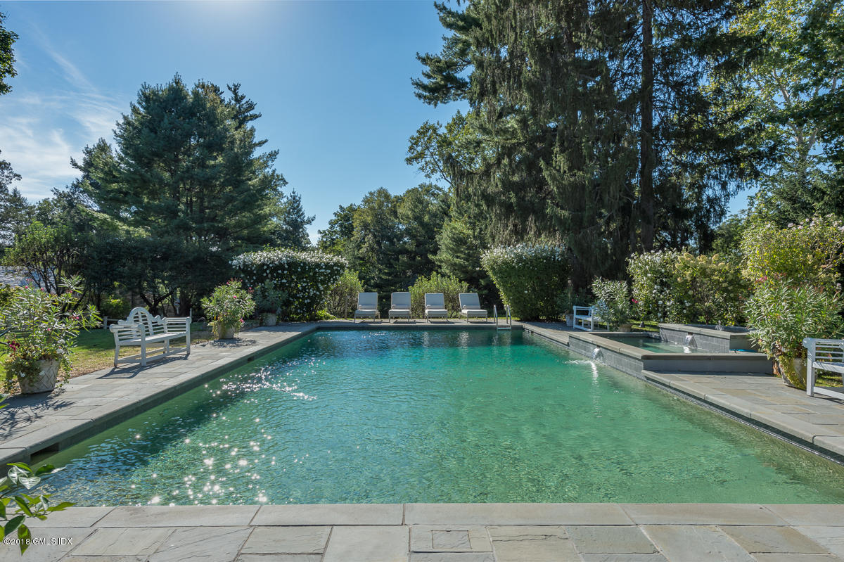 16 Rock Ridge Avenue Greenwich, CT 06831 - Photo 46 of 57 a view of a swimming pool with a patio