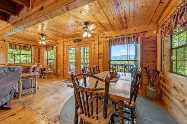 a view of a dining room with furniture window and outside view