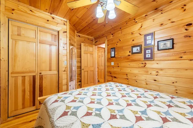 a bedroom with a bed and a cabinets