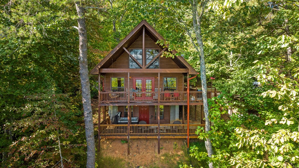 293 Broken Arrow Path Blue Ridge, GA 30513 - Photo 2 of 48 a front view of a house with balcony