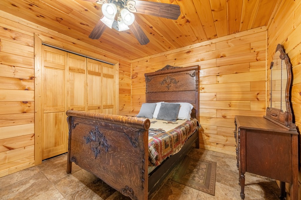 293 Broken Arrow Path Blue Ridge, GA 30513 - Photo 33 of 48 a bed room with a bed and a table