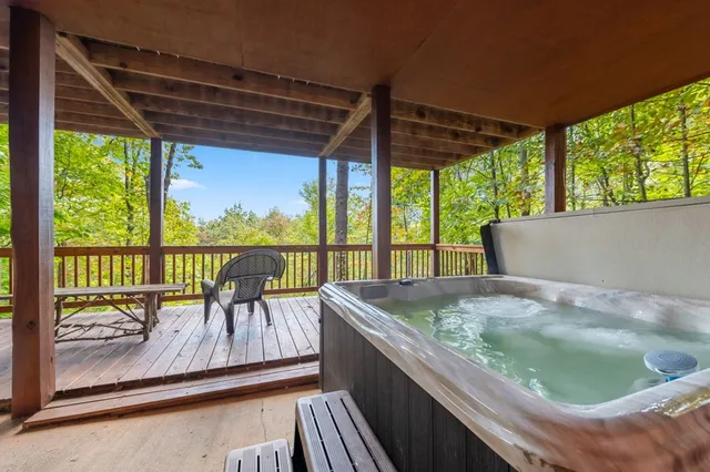 a view of a patio with chairs and wooden floor