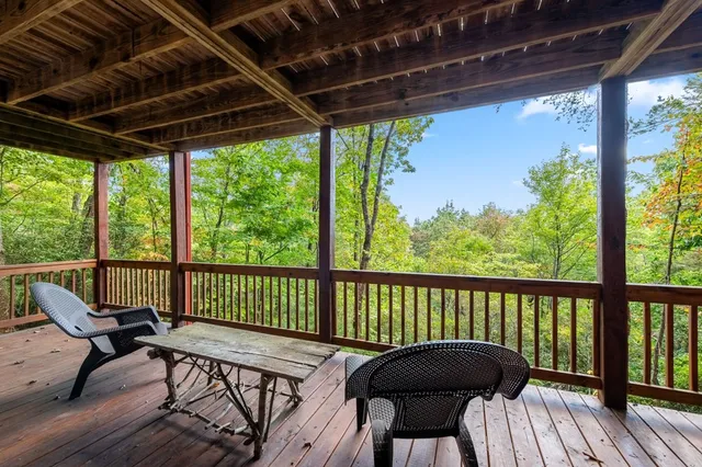a view of small house with a yard