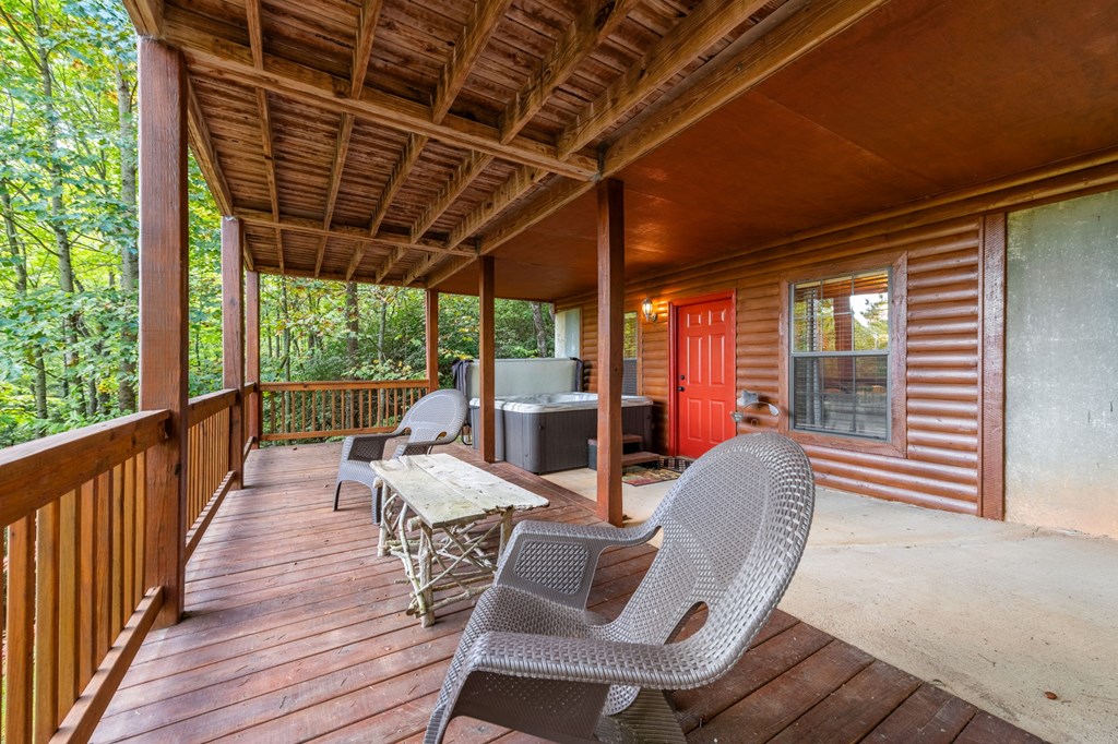 293 Broken Arrow Path Blue Ridge, GA 30513 - Photo 42 of 48 a view of a patio with chairs and wooden floor