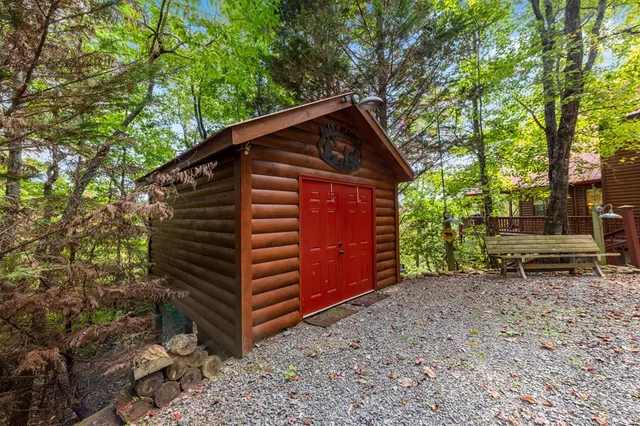 a view of a balcony with furniture and wooden floor