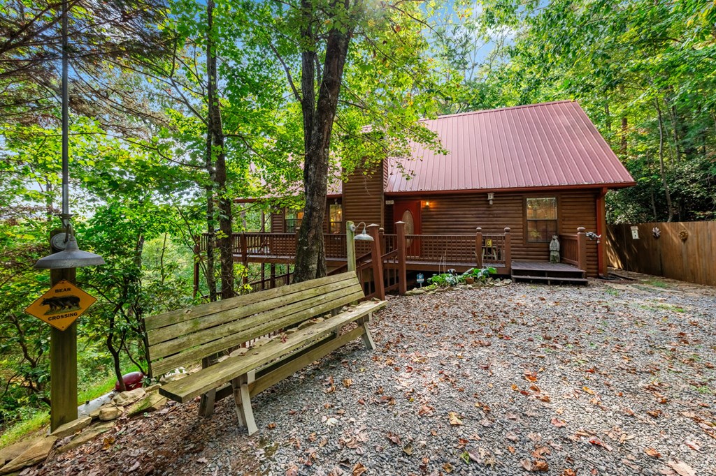 293 Broken Arrow Path Blue Ridge, GA 30513 - Photo 45 of 48 a backyard of a house with barbeque oven table and chairs