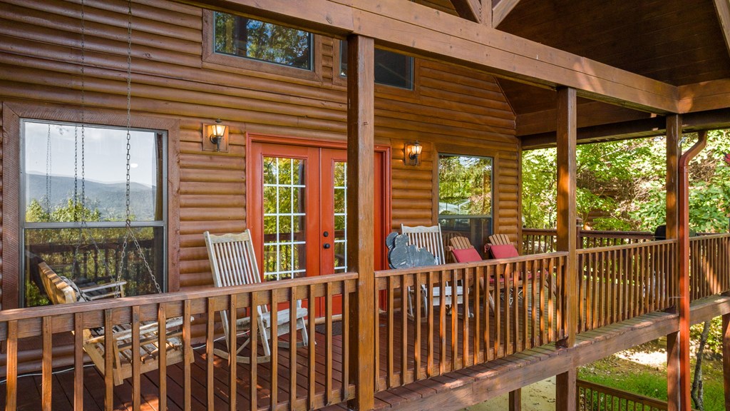 293 Broken Arrow Path Blue Ridge, GA 30513 - Photo 5 of 48 a view of a porch with wooden floor