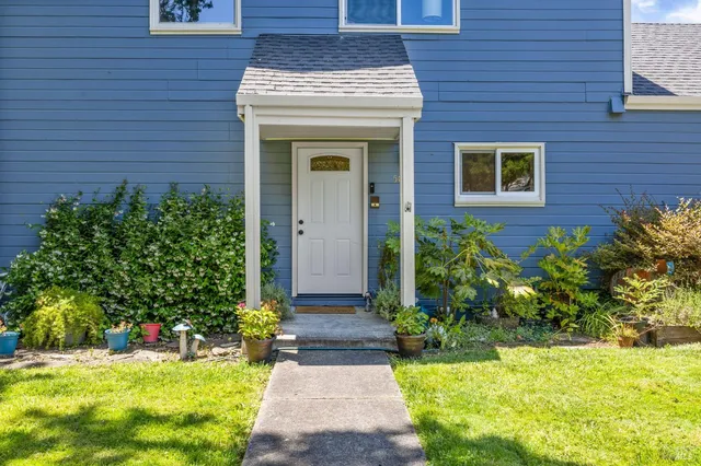 front view of a house with a yard