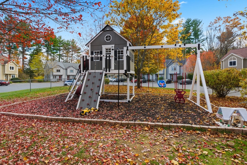 55 Littleton Road, Unit 15A Ayer, MA 01432 - Photo 31 of 37 a front view of a house with garden