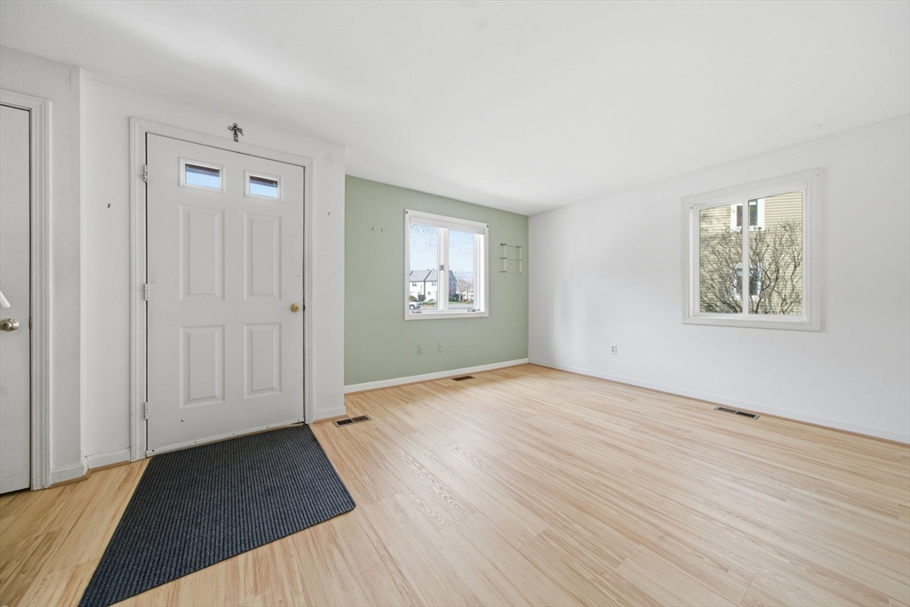 55 Littleton Road, Unit 15A Ayer, MA 01432 - Photo 5 of 37 an empty room with windows and closet