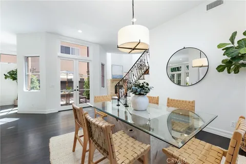 a view of a couches and dinning table and chairs in patio