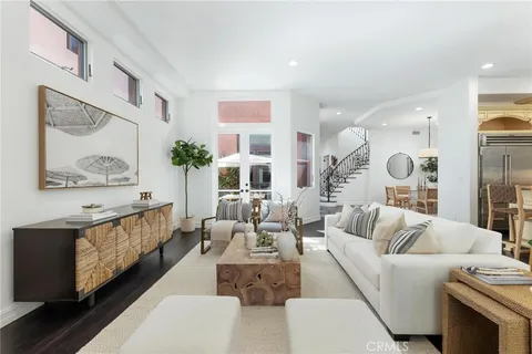 a living room with furniture and a clock