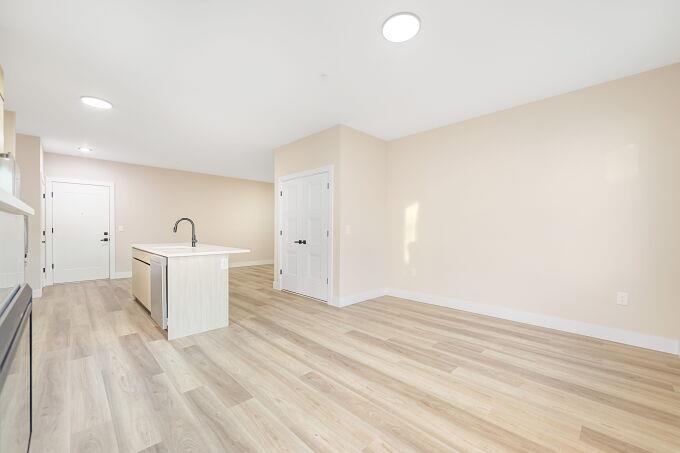 304 61st Street, Unit 3A West New York, NJ 07093 - Photo 16 of 44 a view of a kitchen with wooden floor and a sink