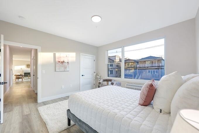 304 61st Street, Unit 3A West New York, NJ 07093 - Photo 41 of 44 a bedroom with a bed and wooden floor