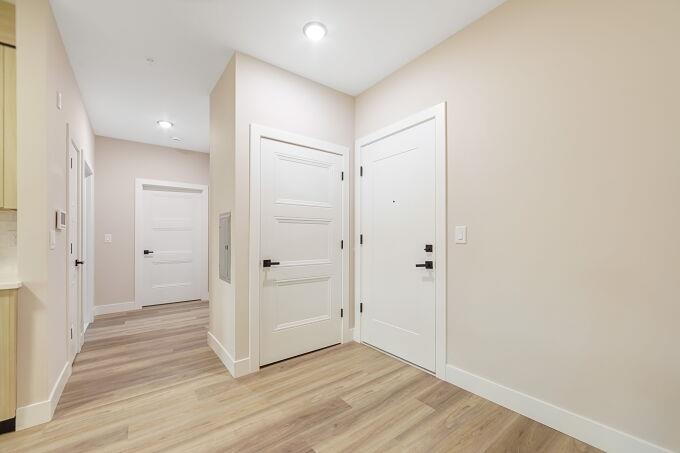 304 61st Street, Unit 3A West New York, NJ 07093 - Photo 9 of 44 a view of a hallway with wooden floor