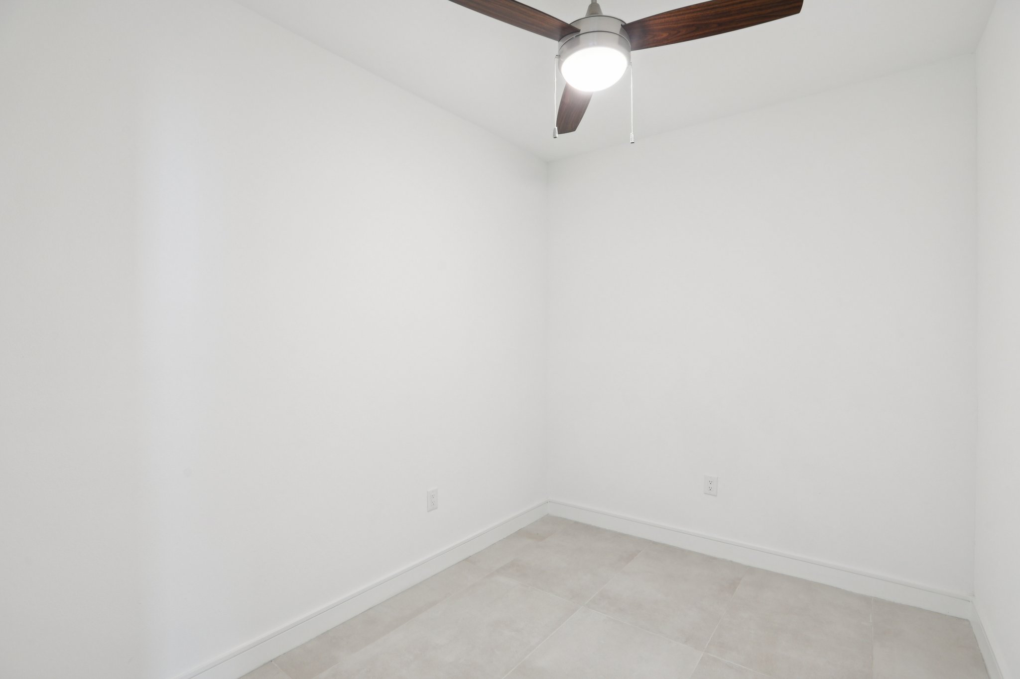 202 Tesla Circle Austin, TX 78681 - Photo 14 of 35 Unfurnished room with baseboards and ceiling fan