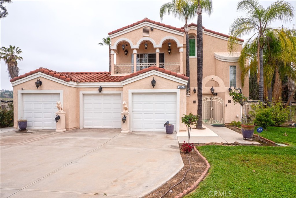 16443 Regency Ranch Road Riverside, CA 92504 - Photo 1 of 1 a view of a house with a yard and palm trees