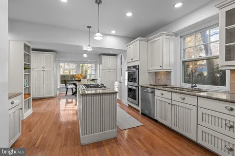 a view of a deck with wooden floor and iron stairs