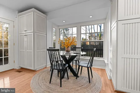 a bathroom with a granite countertop sink a mirror and a shower