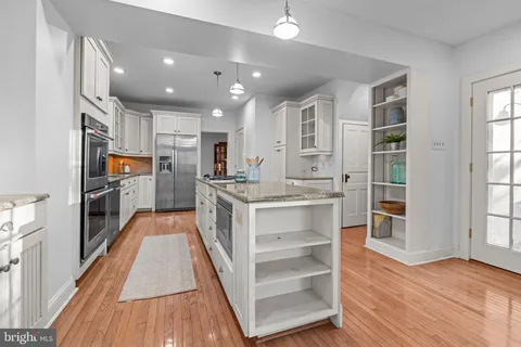 a view of an entryway door with staircase