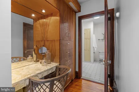 an aerial view of residential house with outdoor space and trees all around