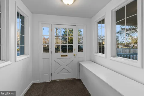 a view of a dining room with furniture wooden floor and chandelier