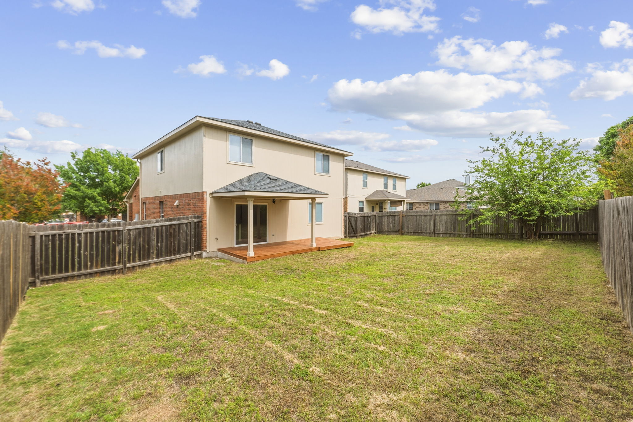 211 Banner Avenue Leander, TX 78641 - Photo 26 of 27 a front view of a house with a yard