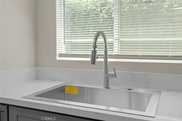 a bathroom with a bathtub and next to a window