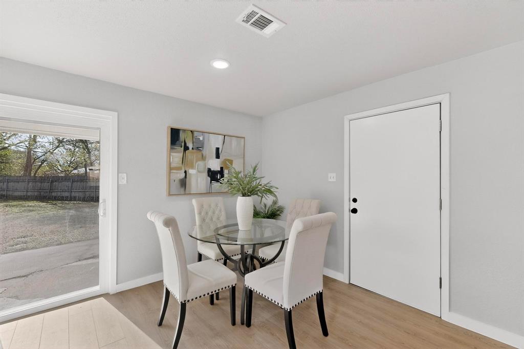 5808 Hanson Drive Watauga, TX 76148 - Photo 12 of 33 a view of a dining room with furniture and wooden floor