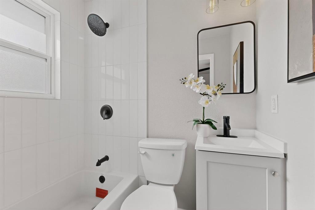 5808 Hanson Drive Watauga, TX 76148 - Photo 20 of 33 a bathroom with a sink a toilet and shower