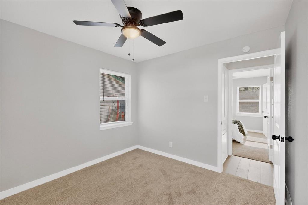 5808 Hanson Drive Watauga, TX 76148 - Photo 25 of 33 a view of a livingroom with a ceiling fan and window