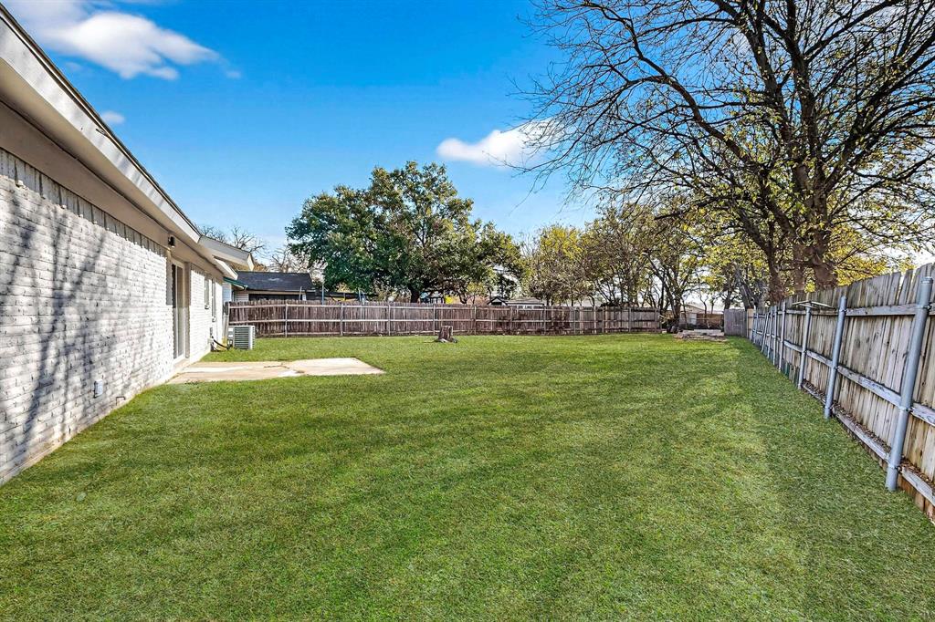 5808 Hanson Drive Watauga, TX 76148 - Photo 32 of 33 a view of outdoor space with garden