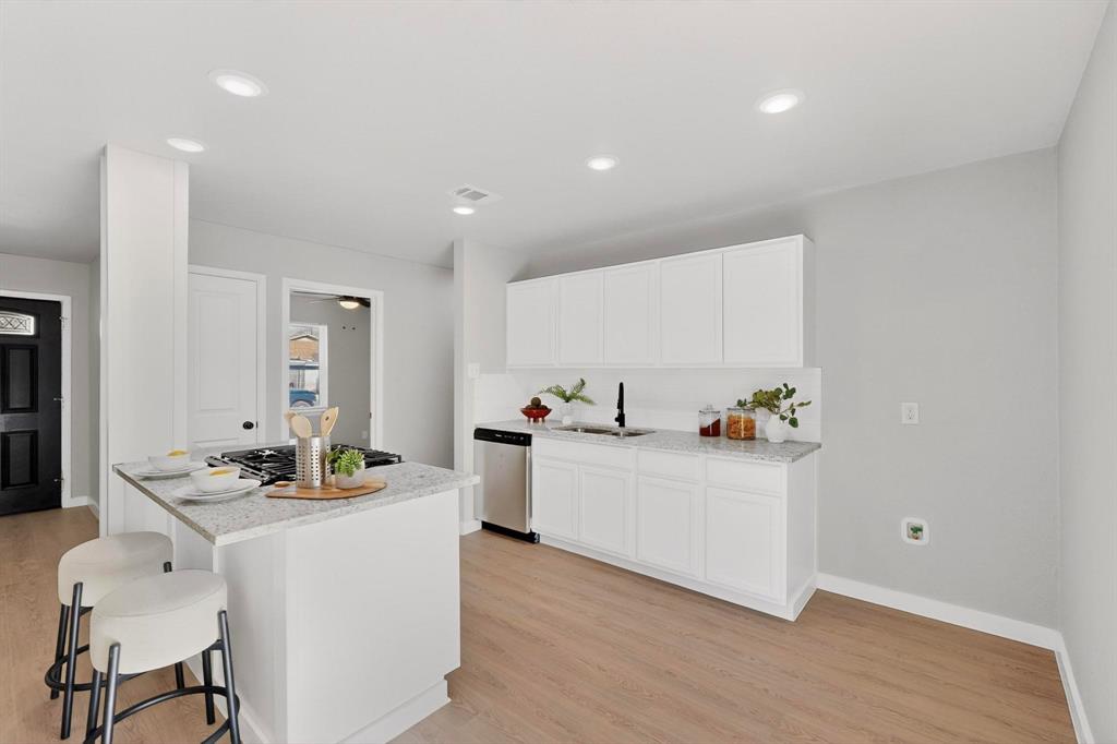 5808 Hanson Drive Watauga, TX 76148 - Photo 8 of 33 a living room with furniture and white cabinets