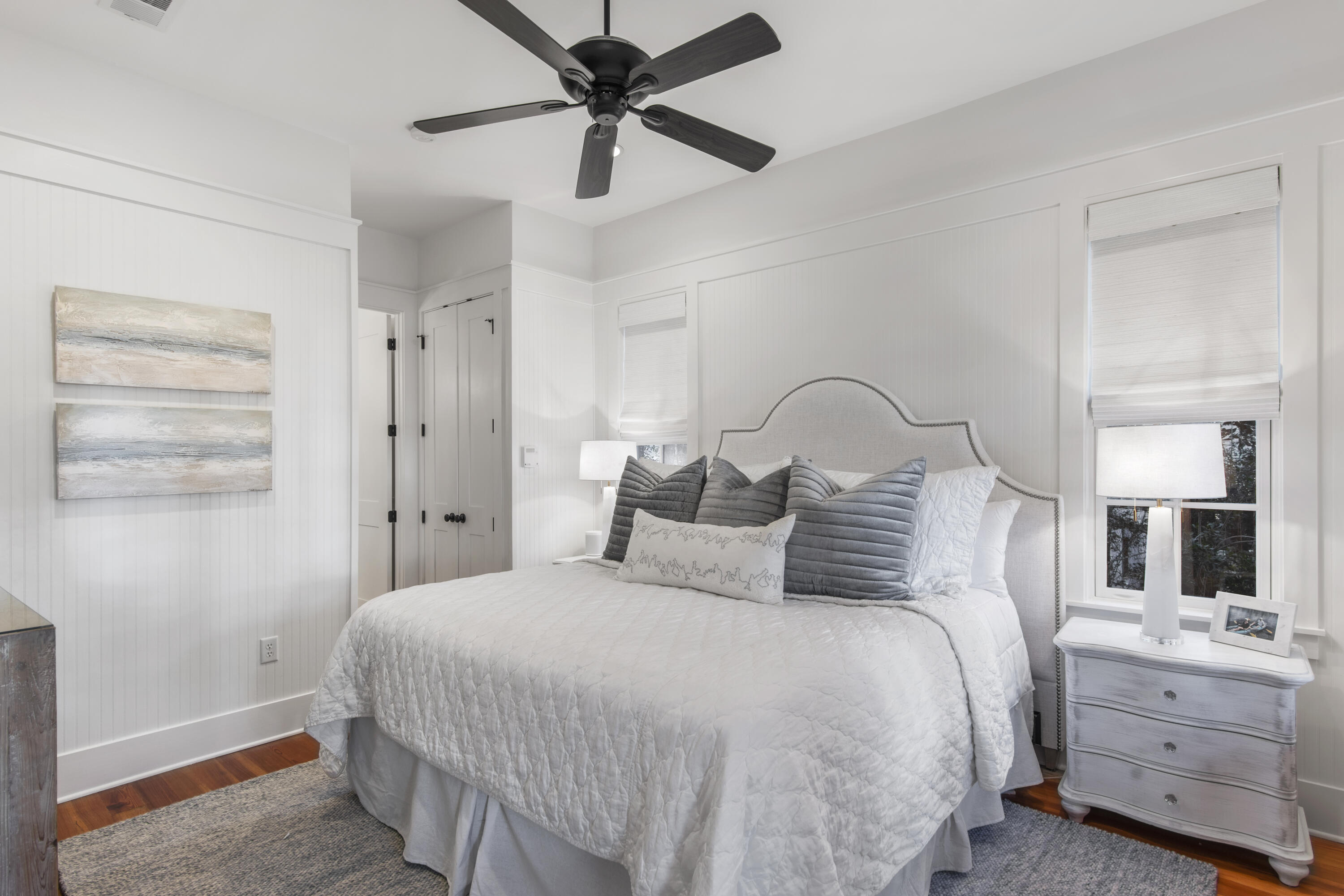 250 Needlerush Drive Santa Rosa Beach, FL 32459 - Photo 12 of 29 a bedroom with a bed and a chandelier
