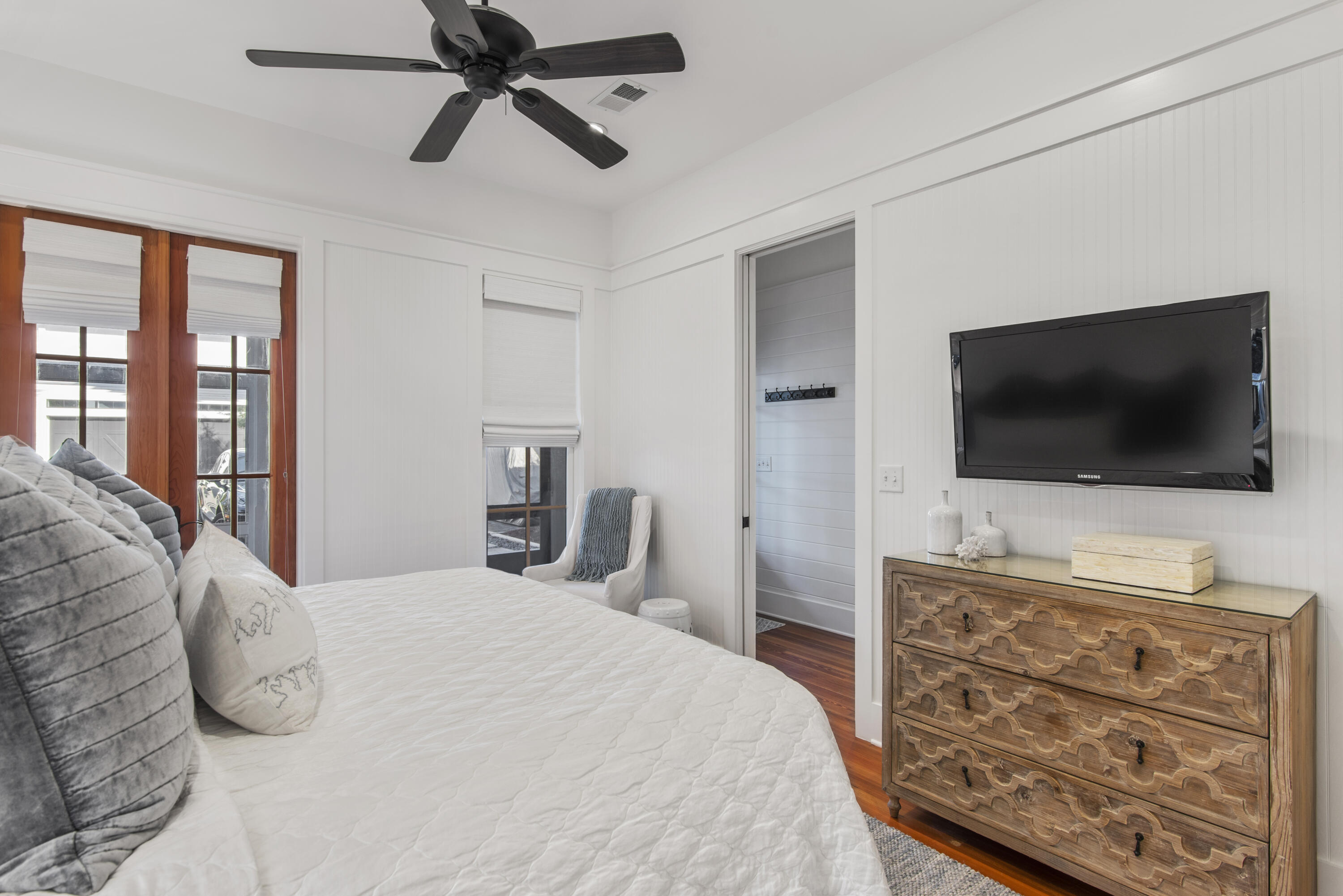 250 Needlerush Drive Santa Rosa Beach, FL 32459 - Photo 13 of 29 a bedroom with a bed and a flat screen tv