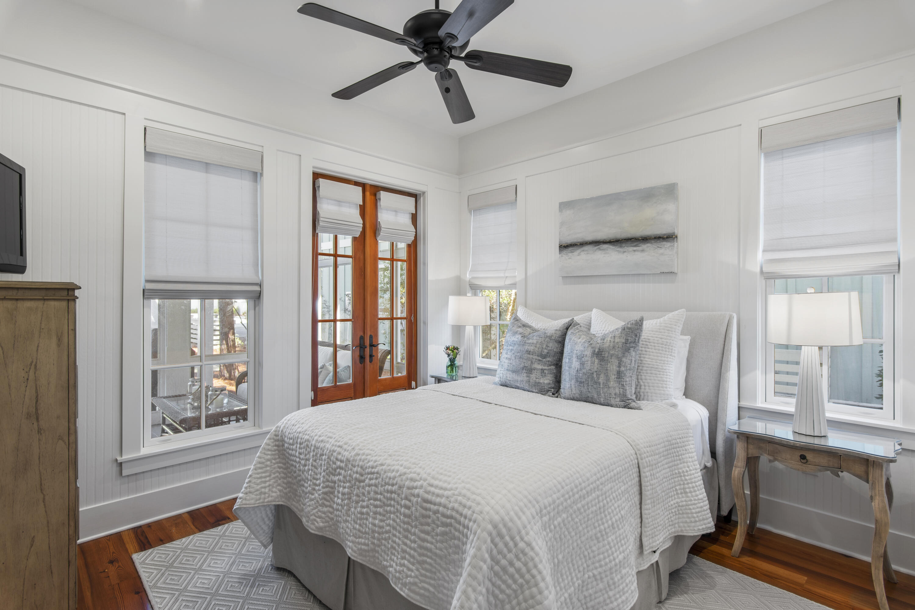 250 Needlerush Drive Santa Rosa Beach, FL 32459 - Photo 15 of 29 a bedroom with a large bed and a chandelier