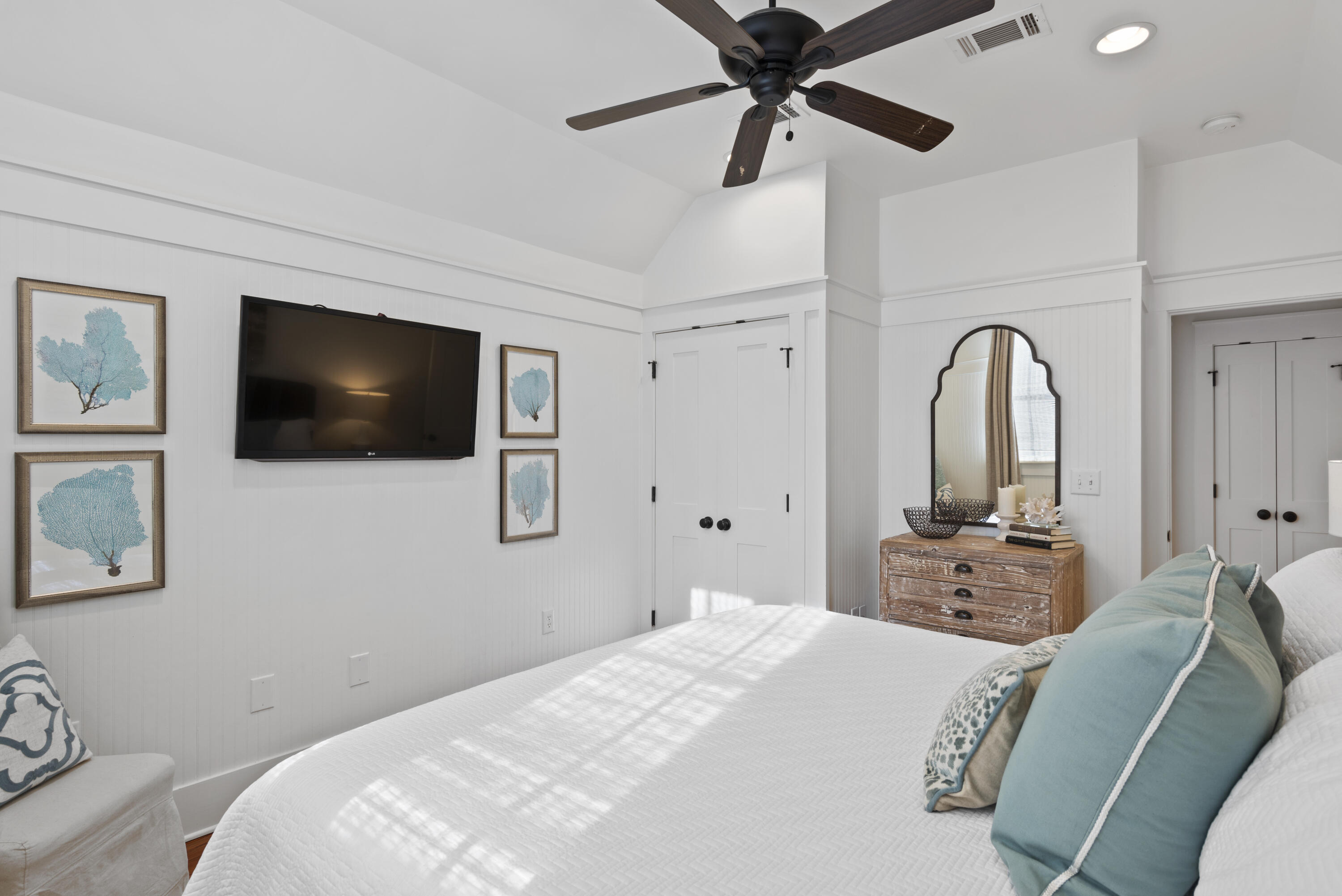 250 Needlerush Drive Santa Rosa Beach, FL 32459 - Photo 18 of 29 a bedroom with a bed and a flat screen tv