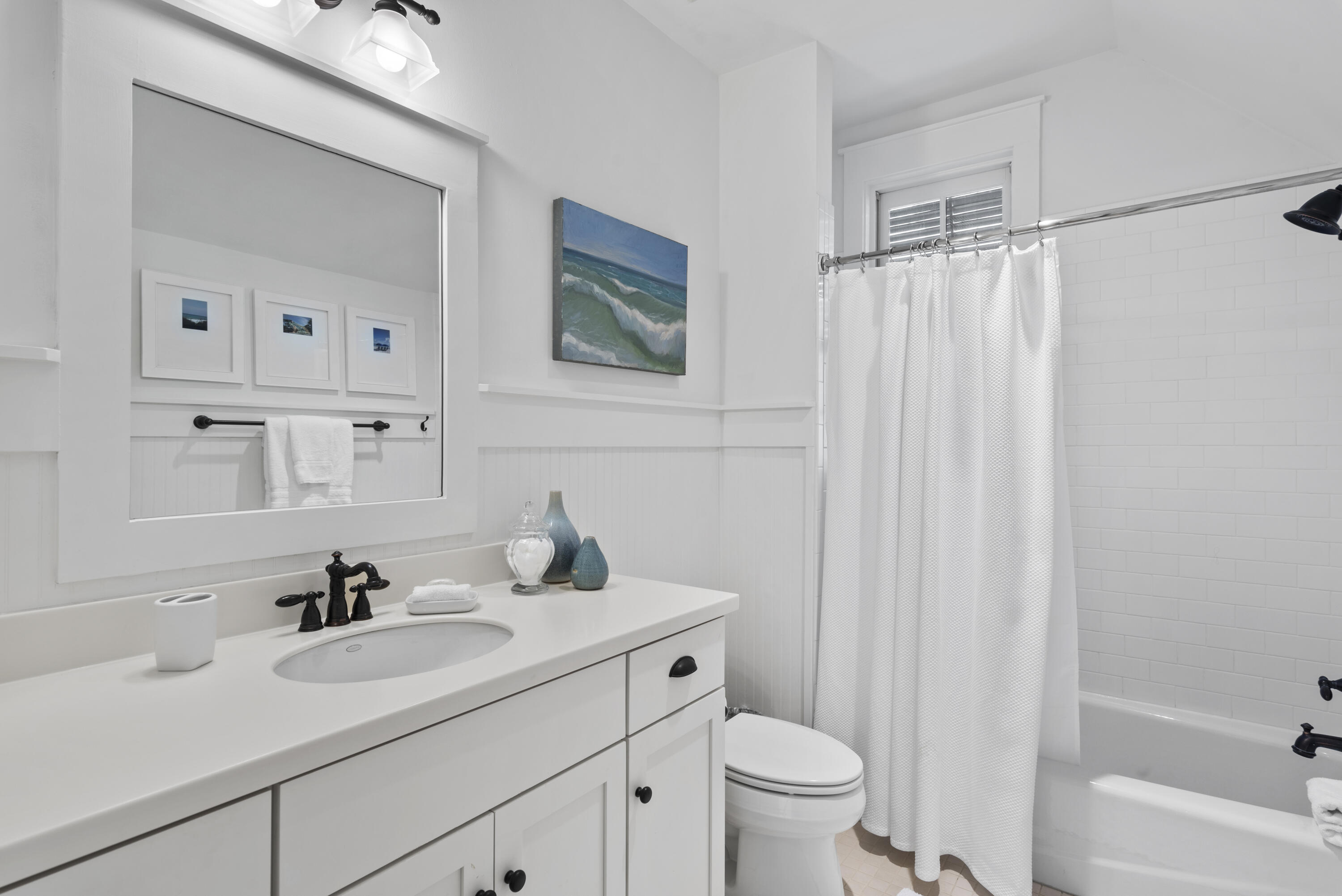 250 Needlerush Drive Santa Rosa Beach, FL 32459 - Photo 19 of 29 a sink and a toilet sitting next to a bathroom sink
