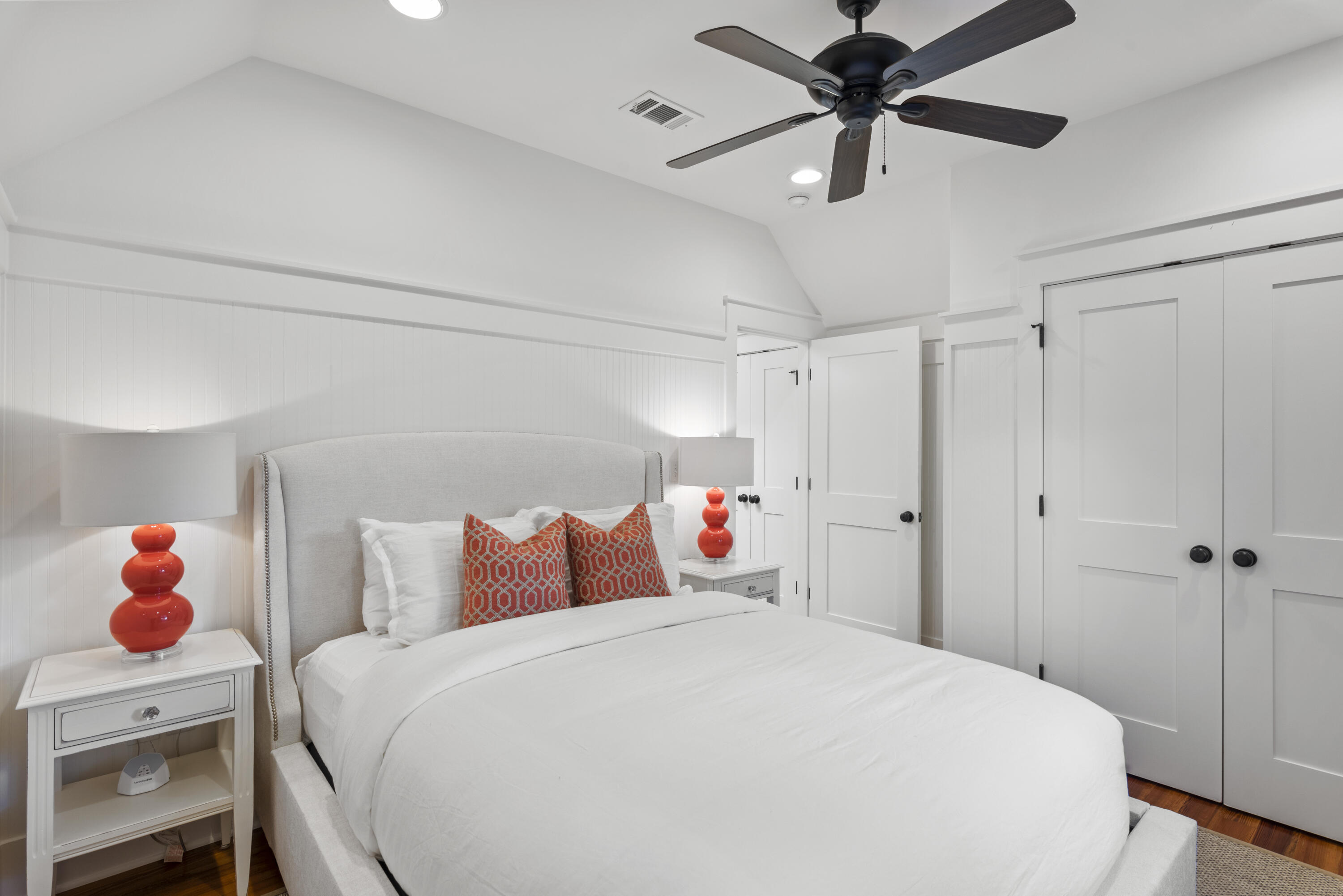 250 Needlerush Drive Santa Rosa Beach, FL 32459 - Photo 21 of 29 a bedroom with a bed and a chandelier