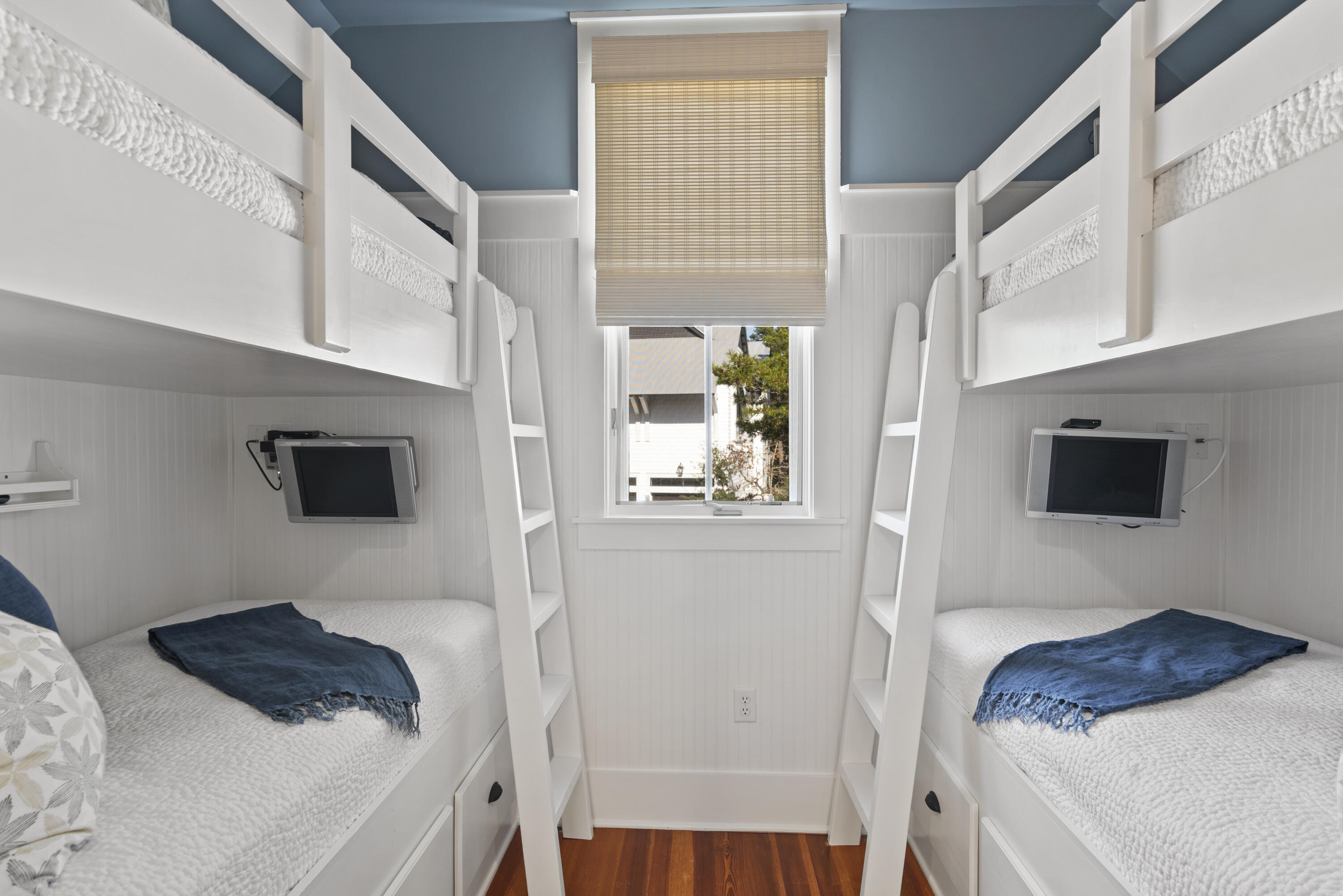 250 Needlerush Drive Santa Rosa Beach, FL 32459 - Photo 25 of 29 a bedroom with a bed a flat tv screen and a window
