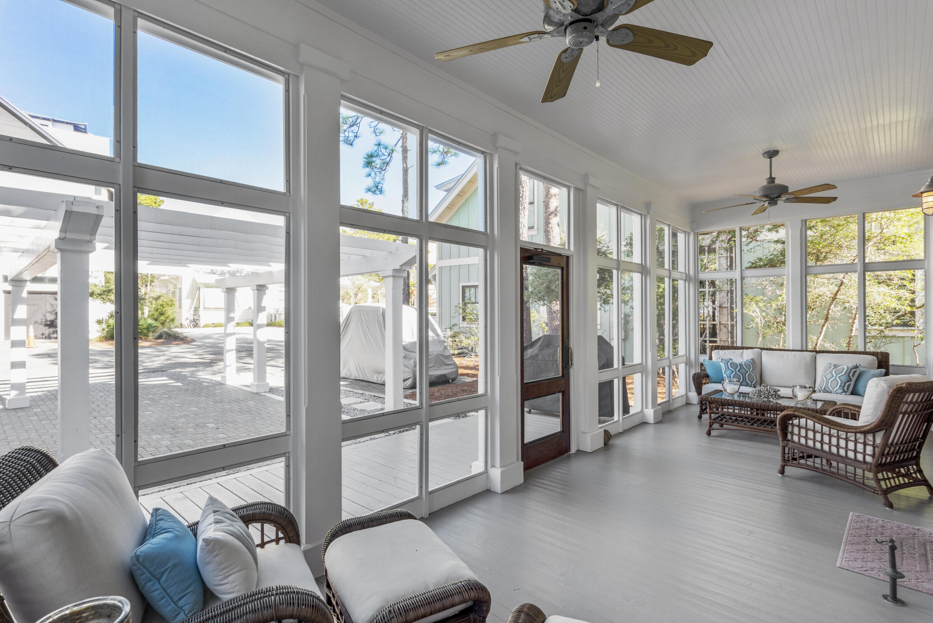 250 Needlerush Drive Santa Rosa Beach, FL 32459 - Photo 26 of 29 a living room with furniture and a floor to ceiling window