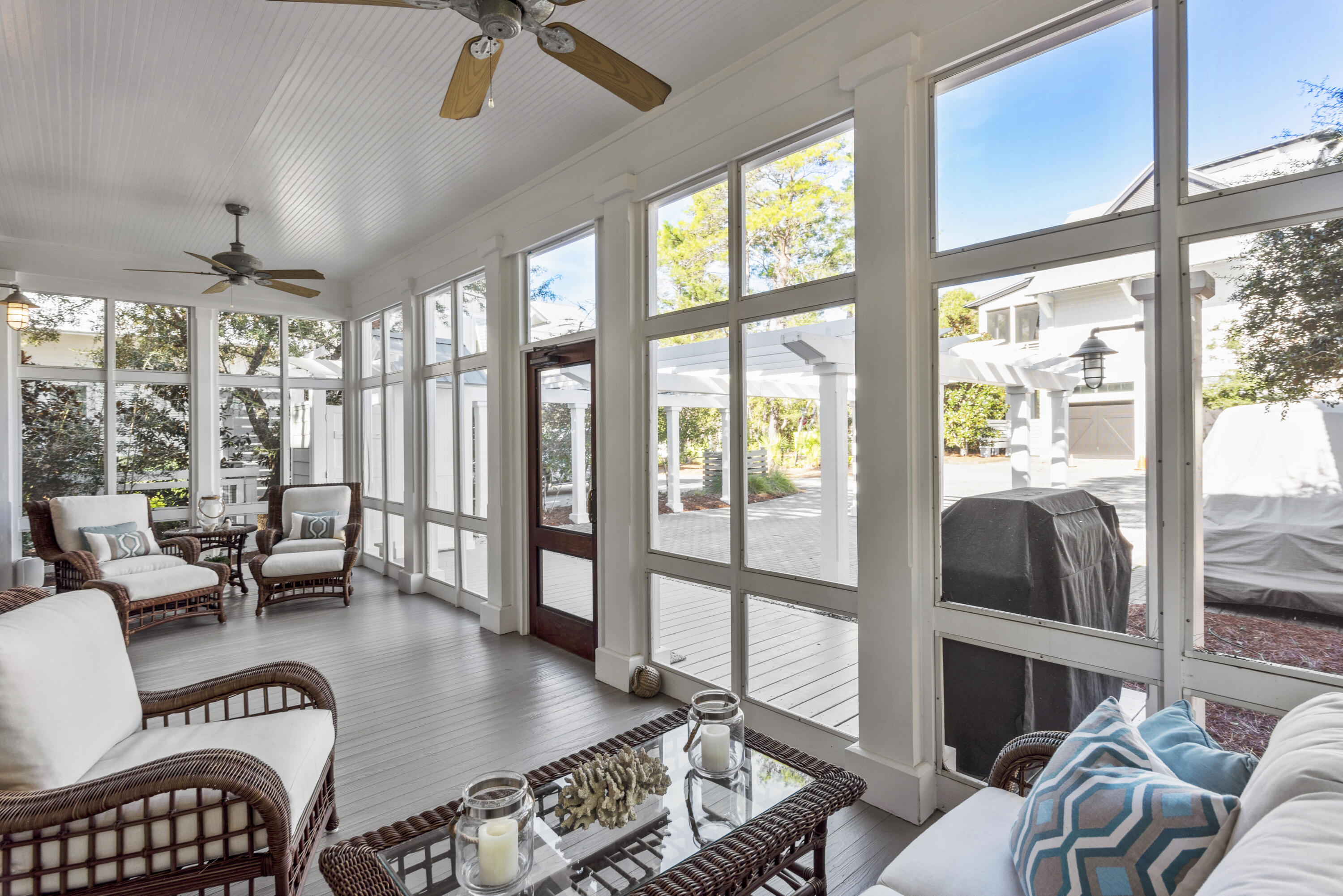 250 Needlerush Drive Santa Rosa Beach, FL 32459 - Photo 27 of 29 a living room with furniture and a floor to ceiling window