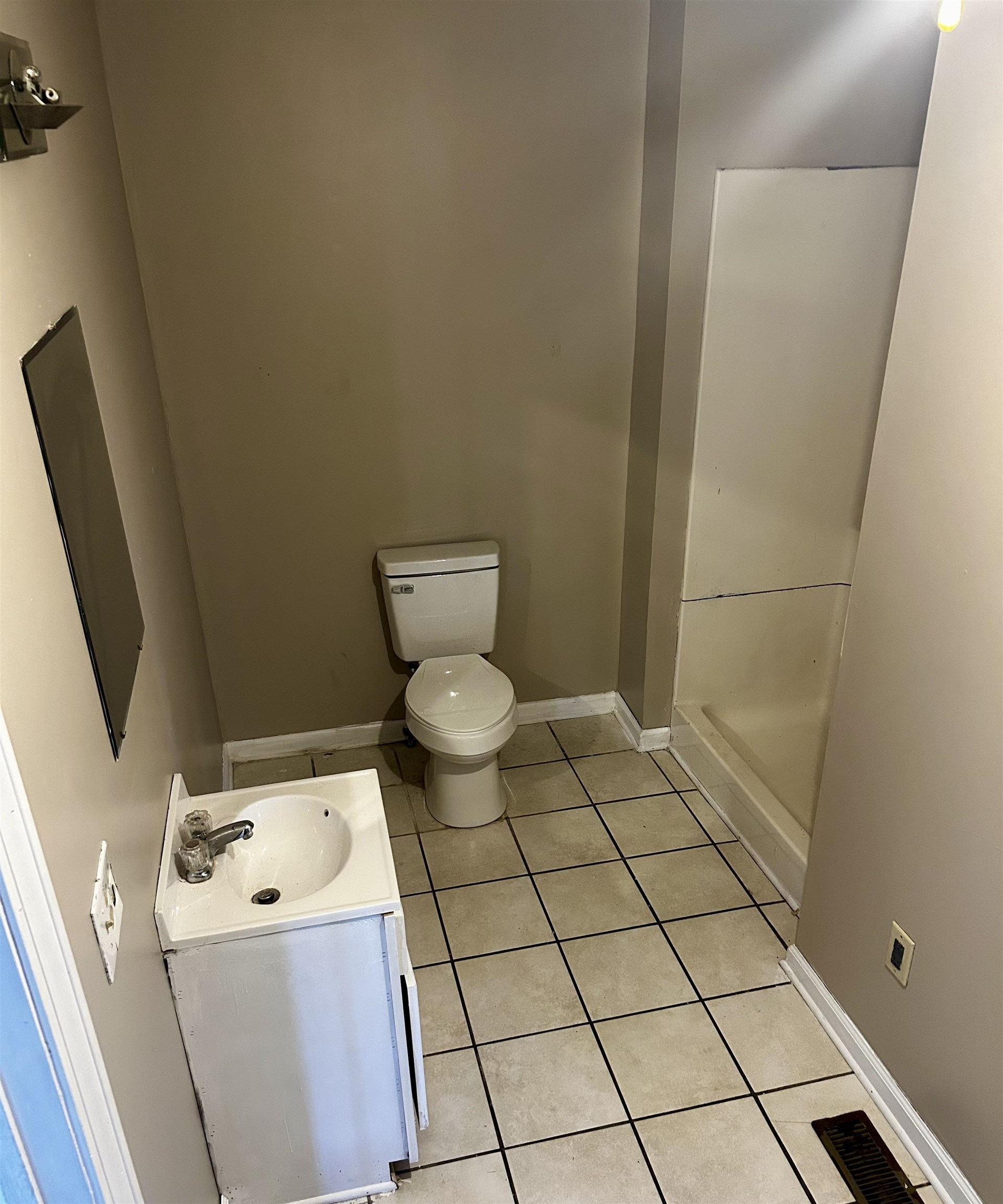 437 Wayne Elam Road Ramer, TN 38367 - Photo 11 of 16 Bathroom with tile patterned flooring, vanity, and toilet