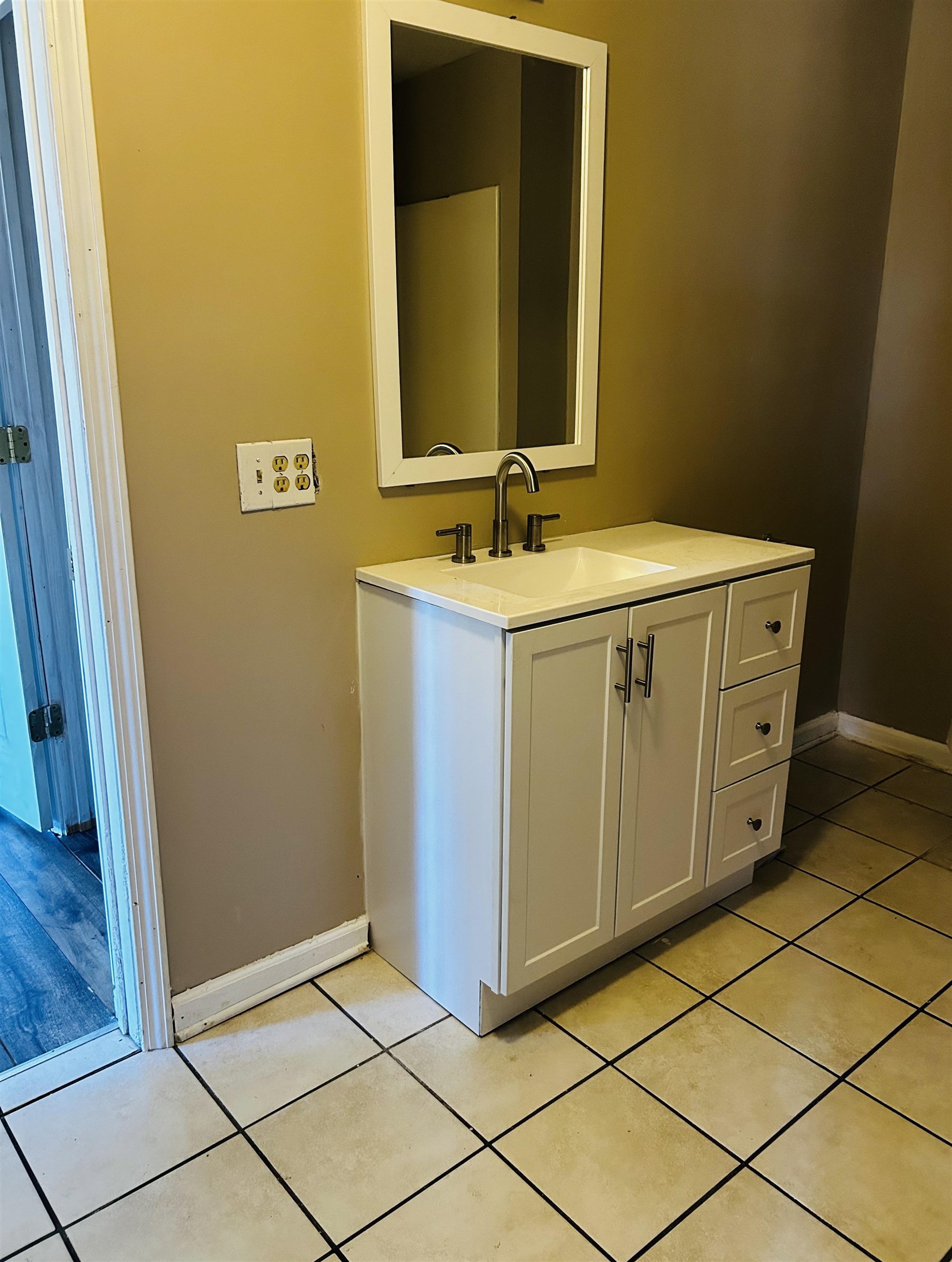 437 Wayne Elam Road Ramer, TN 38367 - Photo 12 of 16 Bathroom featuring tile patterned flooring and vanity
