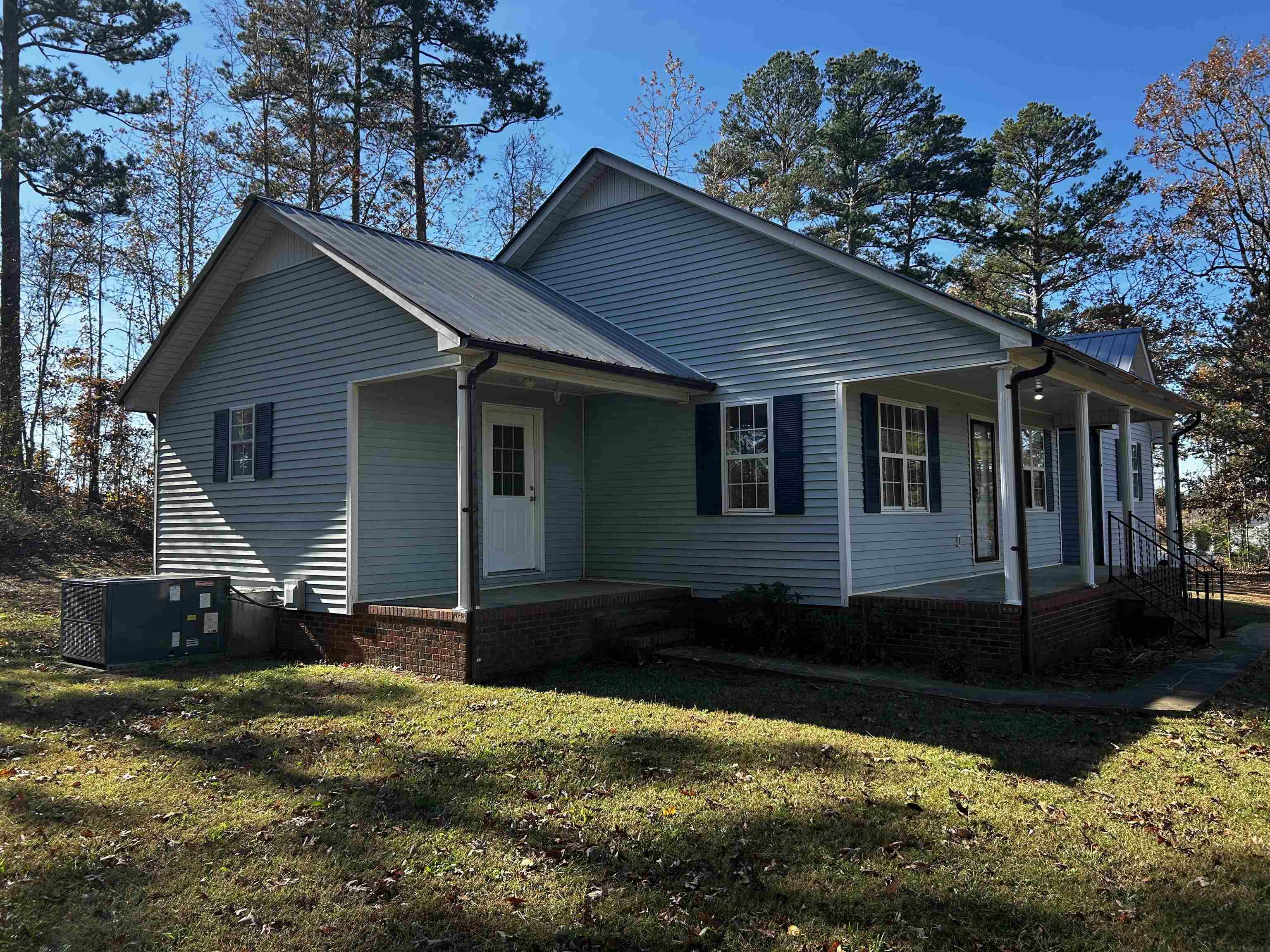 437 Wayne Elam Road Ramer, TN 38367 - Photo 3 of 16 View of front of property featuring a front yard, a porch, and central air condition unit