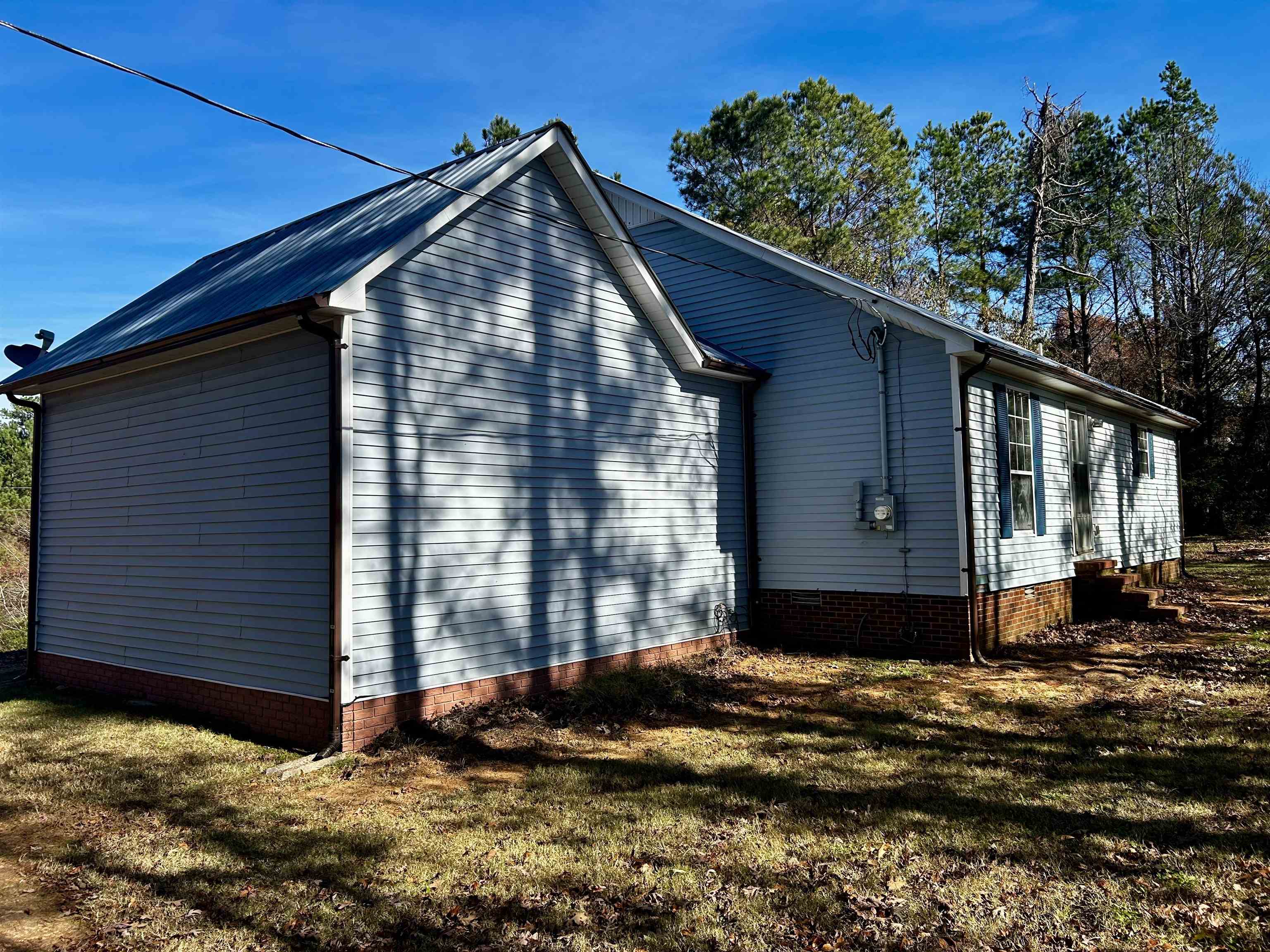 437 Wayne Elam Road Ramer, TN 38367 - Photo 5 of 16 View of side of property with a lawn