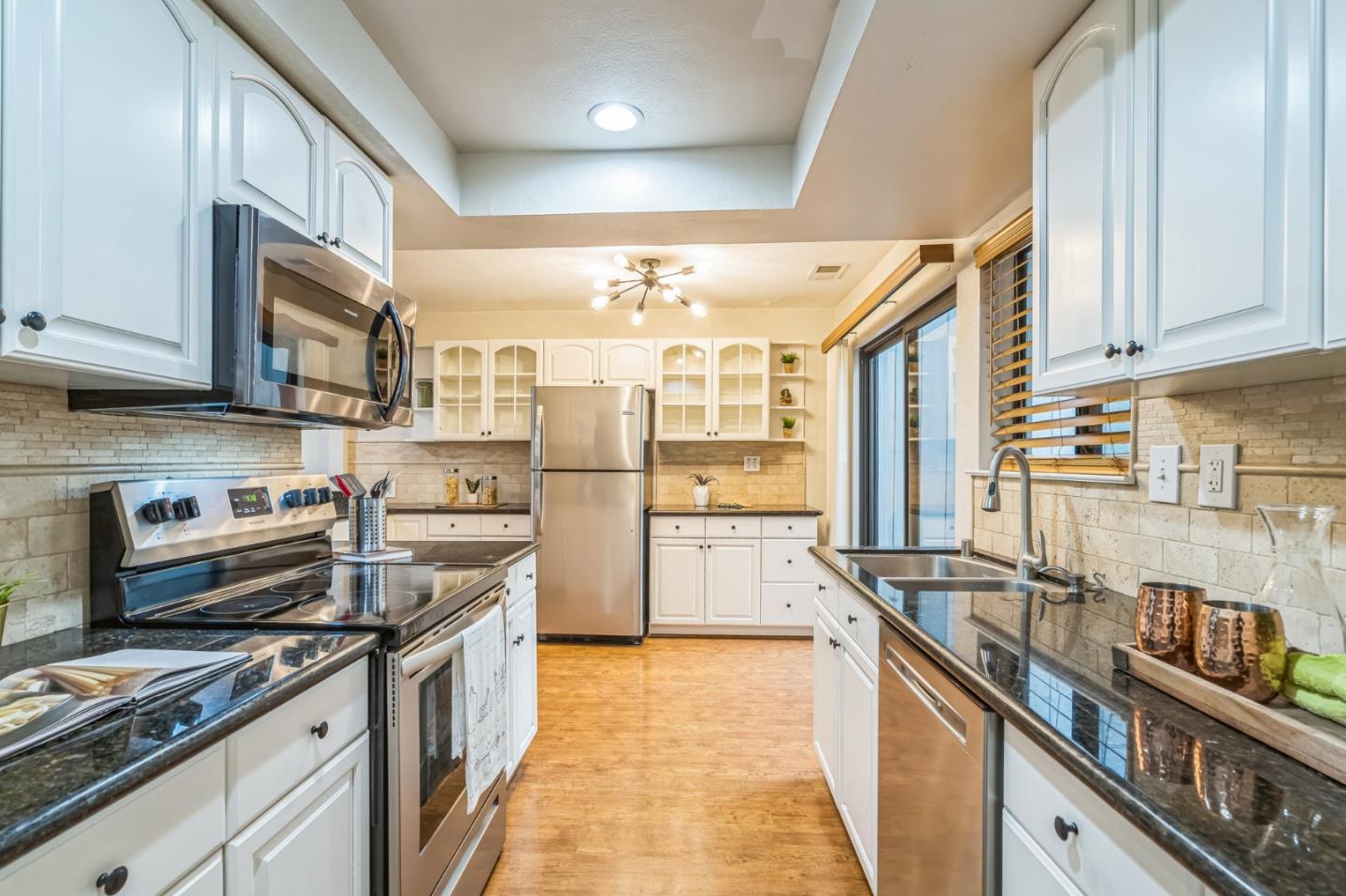 5348 Brookside Court Pleasanton, CA 94588 - Photo 16 of 30 a kitchen with stainless steel appliances granite countertop a stove and a sink